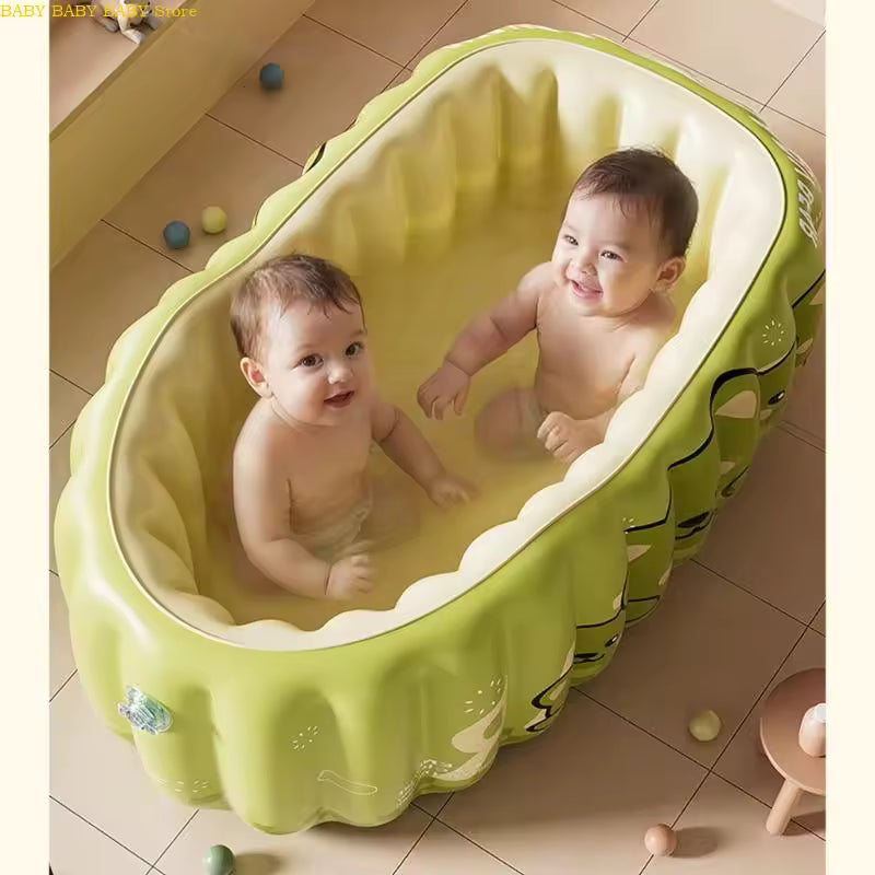 deux bébés assis baignoire bebe gonflable 